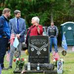 State Rep. Mike Chapman, D-Port Angeles, left, and Clallam County Commissioner Mark Ozias talk with Joan Shields-Bennett before a Sojourner memorial service honoring her late husband, Marvin G. Shields, on Saturday. (Jesse Major/Peninsula Daily News)