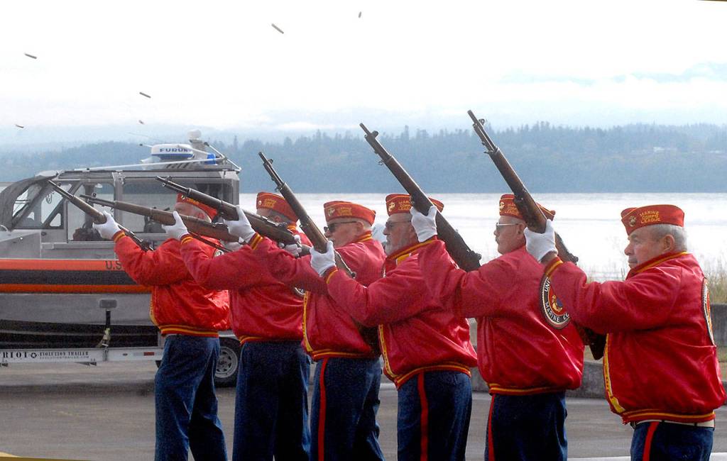 Members of the Mount Olympus Detachment 897 of the Marine Corps League deliver a three-volley rifle salute in honor of fallen veterans. (Keith Thorpe/Peninsula Daily News)