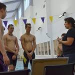 New Sequim boys swim coach Anita Benitez speaks to varsity swimmers about their next exercises. Even though shes new to the team, she said it feels like shes been coaching the team three or four years already. Sequim Gazette photo by Matthew Nash