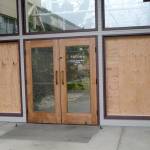 The damaged north entrance to Port Angeles City Hall is shown Saturday, Dec. 2. Police said Wesley Alcorn threw landscaping rocks into the windows. Photo by Rob Ollikainen/Peninsula Daily News