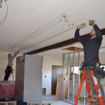 Tyler Philp, left, and Tyler Wickersham with North Peninsula Electric take meaurement for new lighting inside the Guy Cole Convention Centers commercial kitchen. Sequim city staff said Hoch Construction of Port Angeles anticipates the project finishing in late Jan. 2018, and being available for rent the following month. Sequim Gazette photo by Matthew Nash