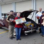 Car club feels drive for giving spirit at Toys for Sequim Kids