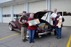 Car club feels drive for giving spirit at Toys for Sequim Kids