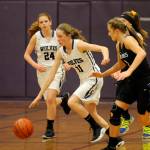 Sequim freshman Abby Schroeder pushes the ball up-court as teammate Alisha Grasser looks on as the Wolves battle North Mason on Dec. 6. Schoreder had six points in the Sequims win. Sequim Gazette photo by Michael Dashiell