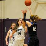 Sequims Hope Glasser looks to block North Mason forward Sophia Greens shot in the Wolves 57-36 win on Dec. 6. Glasser had 14 points and 10 rebounds in the victory. Sequim Gazette photo by Michael Dashiell