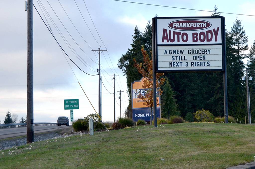 To encourage more business, Chris Frankfurth, owner of Frankfurth Auto Body on U.S. Highway 101, setup his sign to encourage visitors to his other business Agnew Grocery following the closure of the McDonald Creek Bridge for construction. Sequim Gazette photos by Matthew Nash