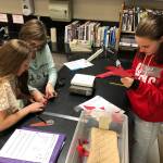 From left, Brooklynn Castle, Lexi Treece and Jenna Finley  students at Sequim Middle School  work to devise a fan blade assembly during the schools Convection Engineering Challenge. Submitted photo