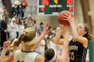 Girls basketball: Riders overwhelm Wolves on hardcourt