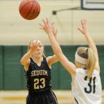 Sequims Melissa Porter,left, passes to a teammate as Port Angeles Summer Olsen defends. Sequim Gazette photo by Michael Dashiell