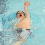 Sequims Jax Thaxton competes in the 100 backstroke on Dec. 14. versus Bermerton. Sequim Gazette photo by Michael Dashiell