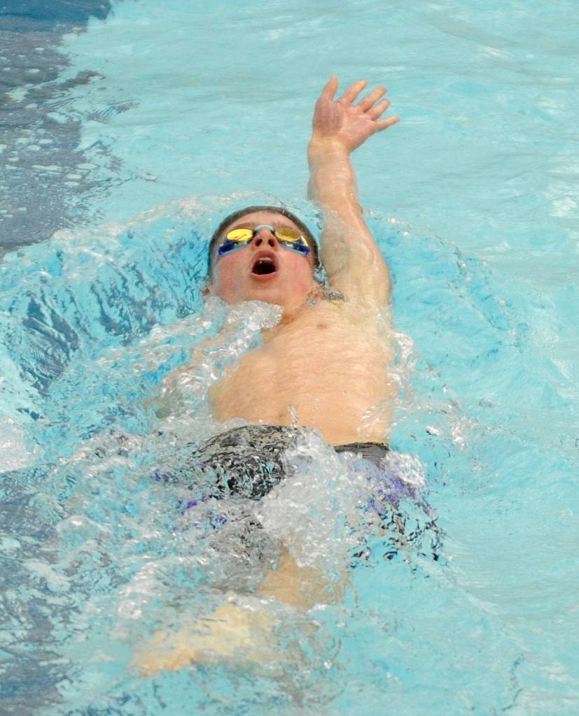 Sequims Jax Thaxton competes in the 100 backstroke on Dec. 14. versus Bermerton. Sequim Gazette photo by Michael Dashiell