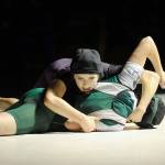 Sequims Megan Puksta, 125 pounds, works her way to pinning Port Angeles Brook Meyer in 2:30. Sequim Gazette photo by Matthew Nash