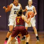 Sequim forward Jayla Julmist (20) keeps an eye on Kingston guard Kylee Walker as Sequims Melissa Porter looks on. Sequim Gazette photo by Michael Dashiell