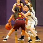 Sequims Kalli WIker (foreground, right) guards Kingstons Leetsah Deem while SHS teammate Jessica Dietzman looks on. Sequim Gazette photo by Michael Dashiell