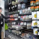 Naomi Blodgett, inventory manager for The Hidden Bush, a recreational marijuana dispensary in Port Angeles, restocks the stores shelves Thursday. (Keith Thorpe/Peninsula Daily News)