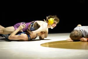Sequims Jamie Schroepfer scored the Wolves lone points against Olympic with a pin in 47 seconds over Tim Porter. Sequim Gazette photo by Matthew Nash