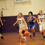 Sequim point guard Bobbi Sparks runs on a fast break past Bremerton defenders on Jan. 19. Sparks finished with nine points and had two steals in the 54-26 win. Sequim Gazette photo by Matthew Nash