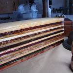 To start her process, Martha Collins laminates and clamps together pieces of exotic hardwoods that shell later through more than a hundred moves create bracelets, bowls and more. Photo by Turningsmith Studios