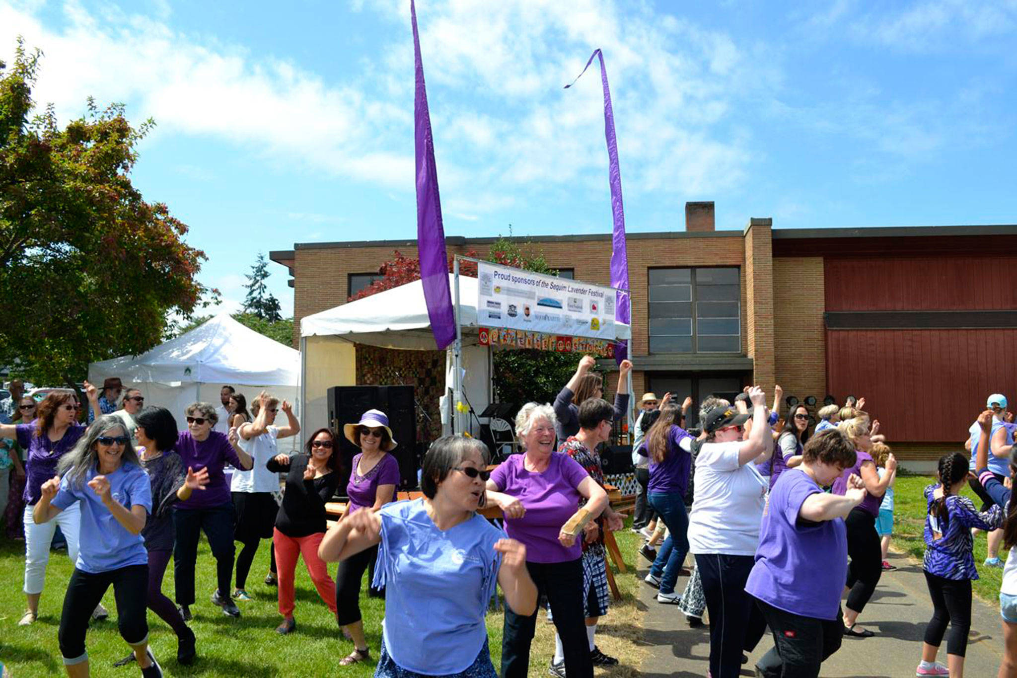 This summer, participants like these dancers seen surprising the crowd with a flash mob at the 2016 Sequim Lavender Festival Street Fair, temporarily move festivities to Carrie Blake Community Park despite construction on Fir Street being moved from this summer to early 2019. Organizers said theyve done too much work to move the event back to Fir Street. Sequim Gazette file photo by Matthew Nash