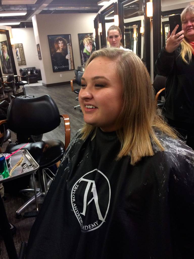Sequim grad Victoria Hall recently had more than a foot of her hair cut off to help create a wig for her mom Robin who is receiving chemotherapy. Victoria, Robin and another relatives hair will help make the wig. Photo courtesy of the Hall Family