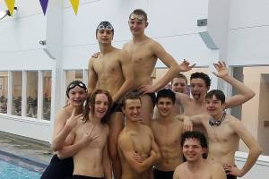 Boys swimming: Wolves quartet sets school 400 free relay mark in district prep meet