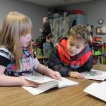 Kindergarten children at Greywolf Elementary have become readers! Here is Kathryn Cardarelles class reading together the unit 6 reader, Kit, from the schools language arts curriculum. Students pictured are Alexia Henning and Zaiden West. Photo by Tricia Stratton