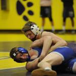 Sequims Ben Newell earned a spot to regionals at 145 pounds. Here he positions himself against Olympics Jonathon Beaulieu but won by injury default. Newell pinned his final two opponents to take third place. Sequim Gazette photo by Matthew Nash