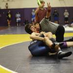 Sequim senior Garrett Harris, a first-year wrestler, pins North Mason Jimmy Burch in the last second of the second round at sub-regionals. Harris went on to become an alternate to regionals with a fifth place finish. Sequim coach Bill Schroepfer said he told players that everything before February was practice and that the season started now. Sequim Gazette photo by Matthew Nash