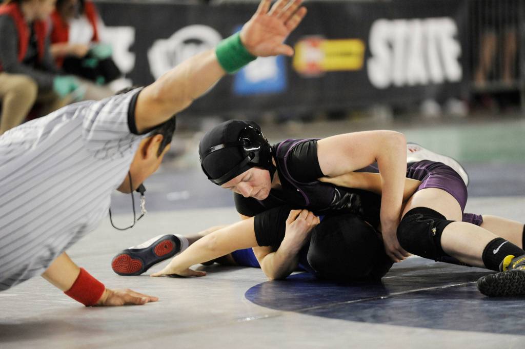Kiara Pierson attempts to pin an early-round opponent at the 2017 state MatClassic. She returns for the fourth year this weekend. Sequim Gazette file photos by Michael Dashiell