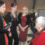 Keith Thorpe/Peninsula Daily News Olympic Medical Center workers, from left, exercise specialist Sherry Xiong, nuclear medical technician Brittany Payseno and cardiac sonographer Kerie Swegle talk with guest Dee Kurtz before the start of Fridays 11th annual Red, Set, Go! Heart Luncheon at Vern Burton Community Center in Port Angeles. The charity event, hosted by the Jamestown S’Klallam Tribe, benefitted the Olympic Medical Center Foundation with goal of raising funds toward the purchase of a nuclear camera for cardiac stress testing.