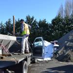 Hank Arnold, a maintenance worker for the City of Sequim, loads sand into his spreader at the City Shop before taking to the city streets to make roadways safer to drive on Feb. 23. Arnold drove one of five city trucks with plows and sand spreaders during the recent snowfall. Sequim Gazette photo by Matthew Nash