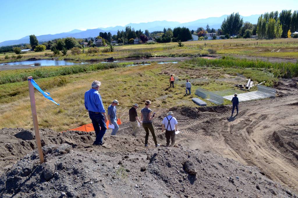 Following a major earthquake, residents along 3 Crabs Road are advised to evacuate from their homes along marshland to higher ground, as seen here from the roads unfinished bridge in 2016. Fire officials with Clallam County Fire District 3 say the bridge will likely be down and residents have about an hour before a tsunami would hit the area. Sequim Gazette file photo by Matthew Nash