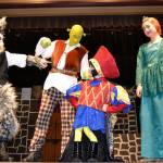 Lord Farquaad (Keaton King), in center, makes his appearance in Shrek the Musical Jr to mixed reaction with other fairy tale characters, from left Donkey (Ayden Humphries), Shrek (Ashton Smith) and Princess Fiona (Kariya Johnson). Sequim Gazette photo by Matthew Nash
