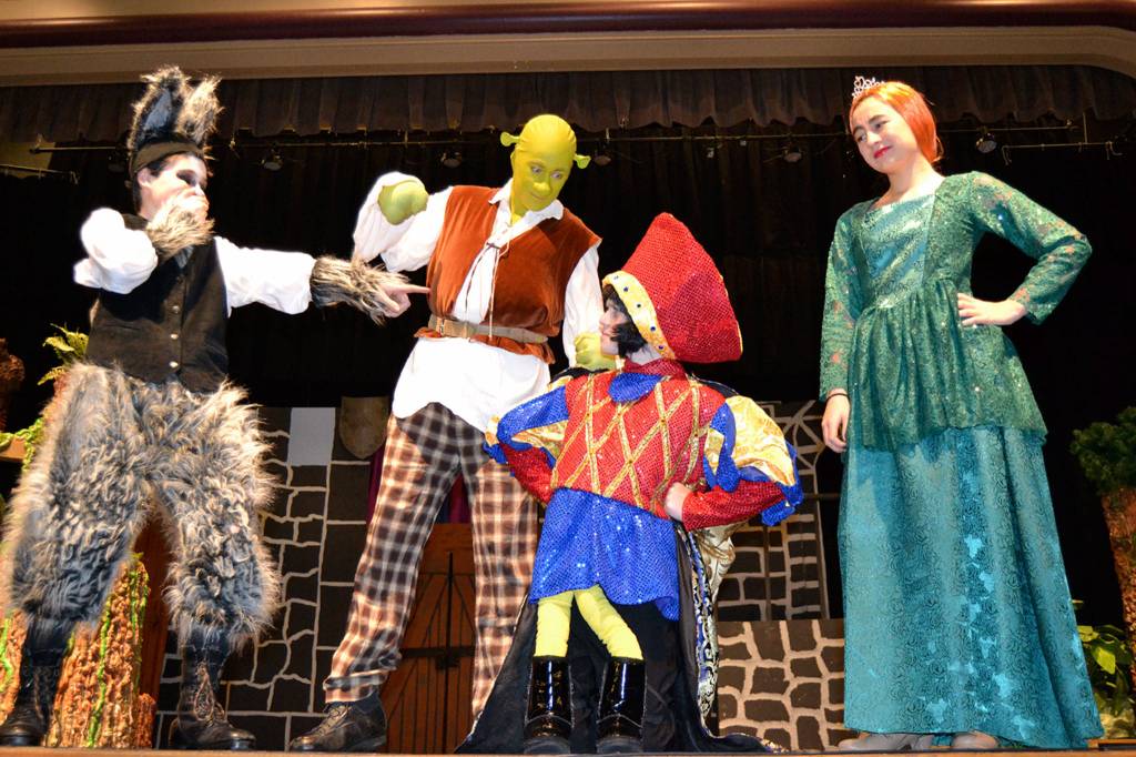 Lord Farquaad (Keaton King), in center, makes his appearance in Shrek the Musical Jr to mixed reaction with other fairy tale characters, from left Donkey (Ayden Humphries), Shrek (Ashton Smith) and Princess Fiona (Kariya Johnson). Sequim Gazette photo by Matthew Nash