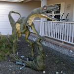 This velociraptor, or deinonychus, stands on a weather vane that its owner Tom Runyan crafted for it to rotate on in front of their home in Dungeness Heights, north of Sequim. Sequim Gazette photo by Matthew Nash