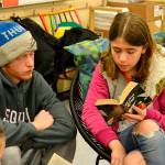 Sierra Lomker of Meredith Vincents fifth grade class reads to high schooler John Stipe for Read Across America Day on March 2. Students from both Sequim High School and Sequim Middle School traveled to Sequims elementary schools to read with younger students. Sequim Gazette photo by Matthew Nash