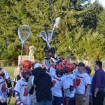 The Port Angeles-Sequim Mountaineers high school boys rally during a timeout at their opener on March 15 at the Agnew Fields. This week, they were scheduled to play three games including two in Agnew. Sequim Gazette photo by Matthew Nash