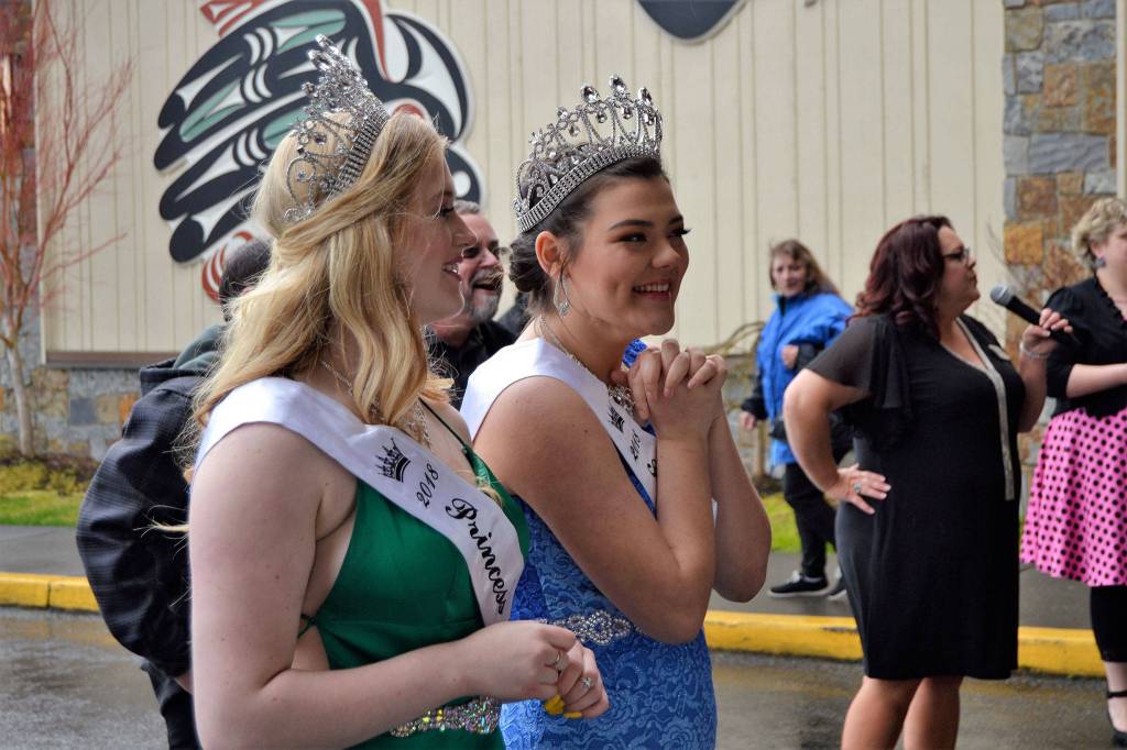 Sequim Irrigation Festival Princesses Eden Batson and Gabi Simonson eagerly await their first chance to stand on the royalty float. Sequim Gazette photo by Matthew Nash