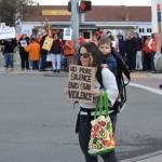 Katie Rodgers of Port Angeles stands with her son Liam, 18 months, on one of the corners of Sequim Avenue and Washington Street in Sequim on March 24 advocating for stricter gun control policies. I hope it speaks volumes for a small town to show support for an event like this, she said.