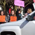 Laura Fierro and her daughter Wren Fierro, 15, stand near Dylan Jackson, 14, and his grandmother Loretta Vlaardingerbroek advocating for stricter gun control on March 24 as part of the March for Our Lives rally. Both the Sequim students participated in the National Walkout on March 14 too, they said. Sequim Gazette photos by Matthew Nash