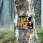 Neighbors surrounding 313 McDonnell Creek Road have put up no trespassing signs. (Jesse Major/Peninsula Daily News)