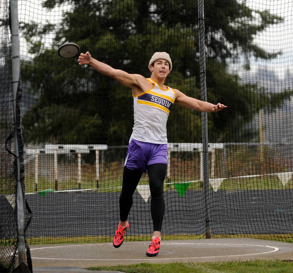 Sequim High senior Payton Glasser sets a personal best in the discus with a 115-foot throw at the March 29 Flying A Retro track and field meet in Port Angles. He topped second place finisher Dante Light of Port Angeles by about 7 feet. Sequim Gazette photo by Michael Dashiell