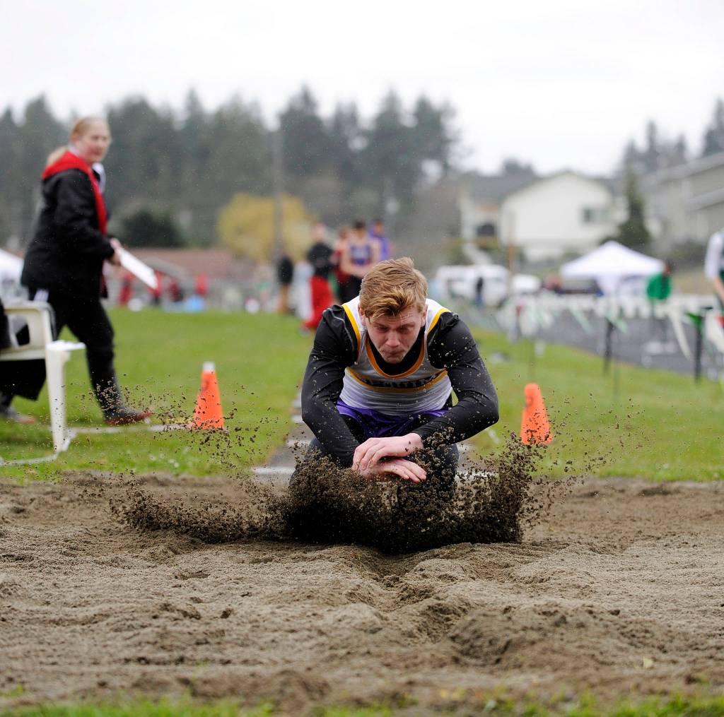 Sequim freshman Logan Laxson takes top honors in the long jump with an 18-foot, 2.5-inch leap at last weeks Flying A Retro track and field meet in Port Angeles on March 29. Sequim Gazette photo by Michael Dashiell
