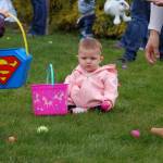Mollie Lou Evans, 11 months, clutches an egg matching her pink basket at the Elks Lodge Easter egg hunt on March 31. Sequim Gazette photo by Erin Hawkins