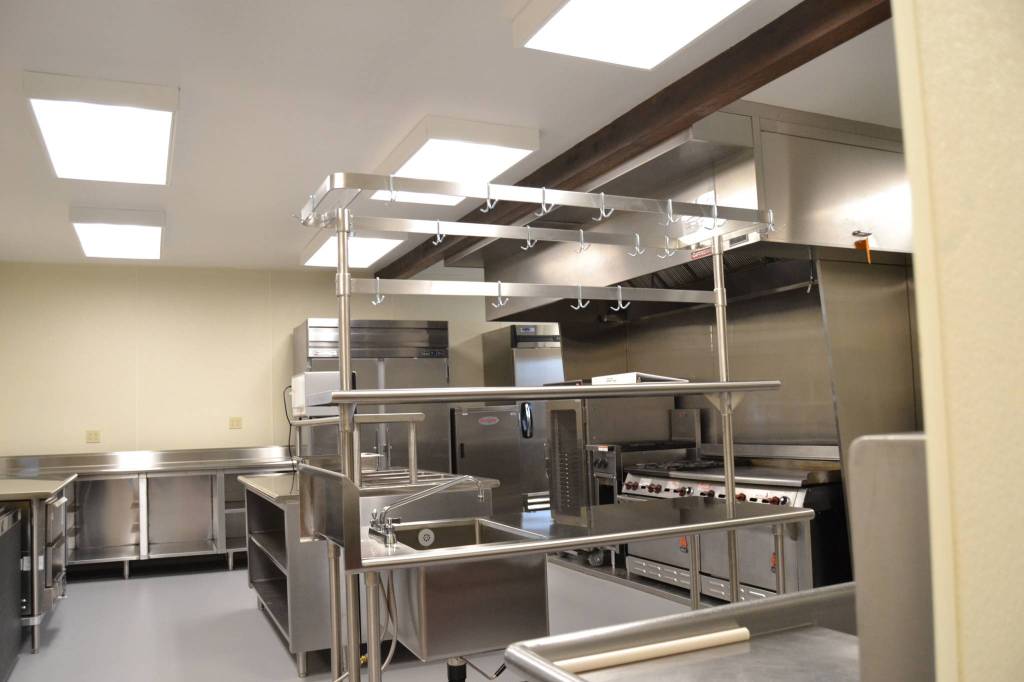 Work to refurbish the Guy Cole Events Centers kitchen included installing a new oven hood and fire suppression system, a freezer, ice machine, lighting, and flooring along with providing electrical and plumbing hookups for future items. Sequim Gazette photo by Matthew Nash