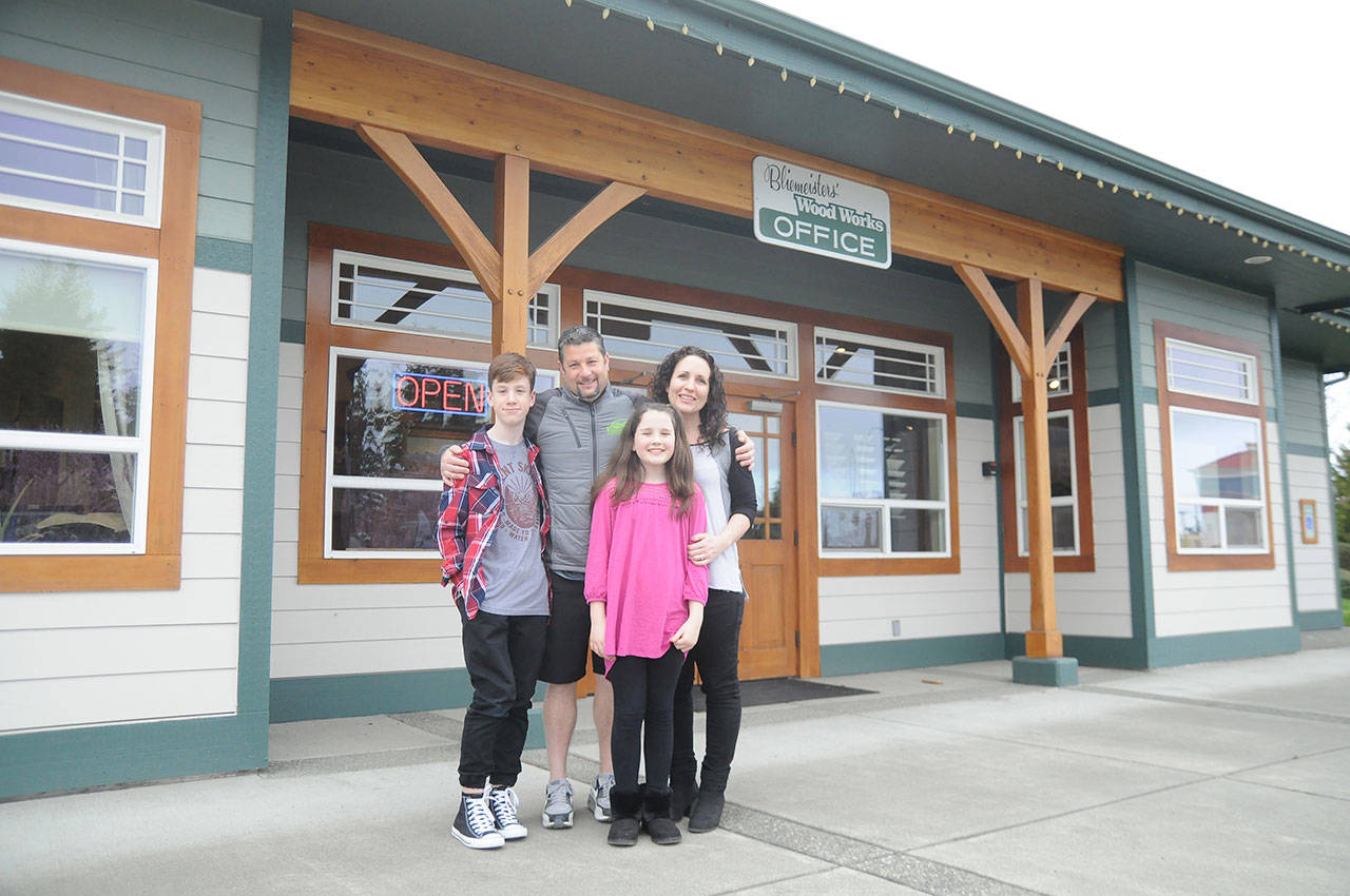 Jason Doig, his wife, Jeni, and children Ethan, 10, and Rylie, 10, outside Doigs business, Bliemeisters Wood Works in Carlsborg. (Michael Dashiell/Olympic Peninsula News Group)