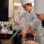 Sequim High School students Hannah McDowell, Jessica Lato and Jacob Myers take a brief break before getting back to cooking spaghetti as they and other culinary arts students cap off the first semester in January. The high schools culinary arts and agriculture science programs are highlighted at this years Sequim Sunrise Rotary dinner-auction set for April 28. Sequim Gazette file photo by Michael Dashiell