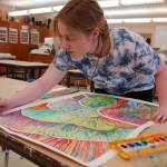 Sequim High School senior Haelee Andres touches up an abstract watercolor painting she is planning to submit to the Sequim Education Foundation Art Show on display at 6 p.m. on Friday, April 20, at the Sequim School District Board room. Sequim Gazette photo by Erin Hawkins