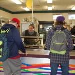 Students at Sequim School District are able to get free or reduced lunch and breakfast if they are eligible to participate in the federal assisted free and reduced lunch meal program. Two students at Sequim High School receive lunch from Corrine Wallen, a breakfast and lunch staff member at Sequim High School. Sequim Gazette photo by Erin Hawkins