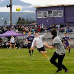 Sequims Adrian Funston tries to track down the ball deep in North Kitsap territory at Viking goalkeeper Matthew Tucker makes a play. Funston had two of the Wolves five scores in a 5-0 win Friday night. Sequim Gazette photo by Michael Dashiell